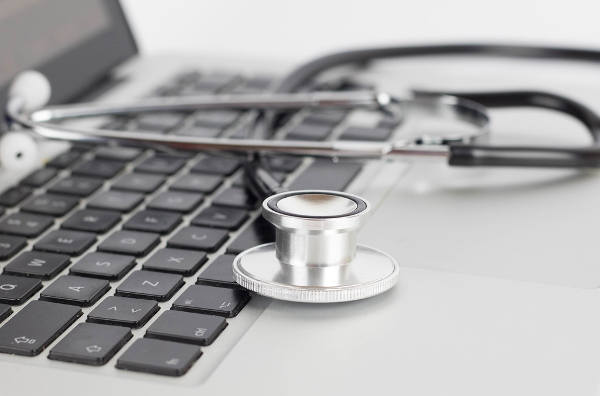 Stethoscope on laptop keyboard